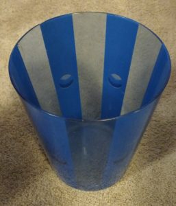 Seriously, a small blue trash can.